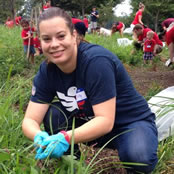 Our president, a woman, helping to weed on the national mall.